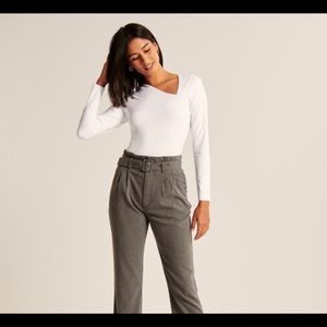 White asymmetrical long sleeve bodysuit